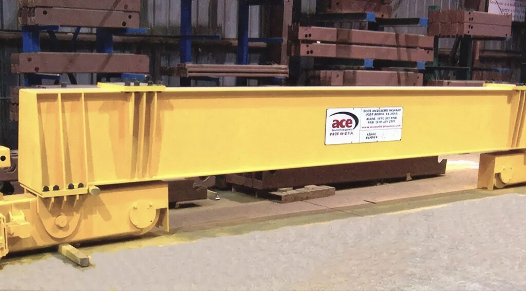 Close-up of ACE single girder end truck wheel assembly and drive motor.